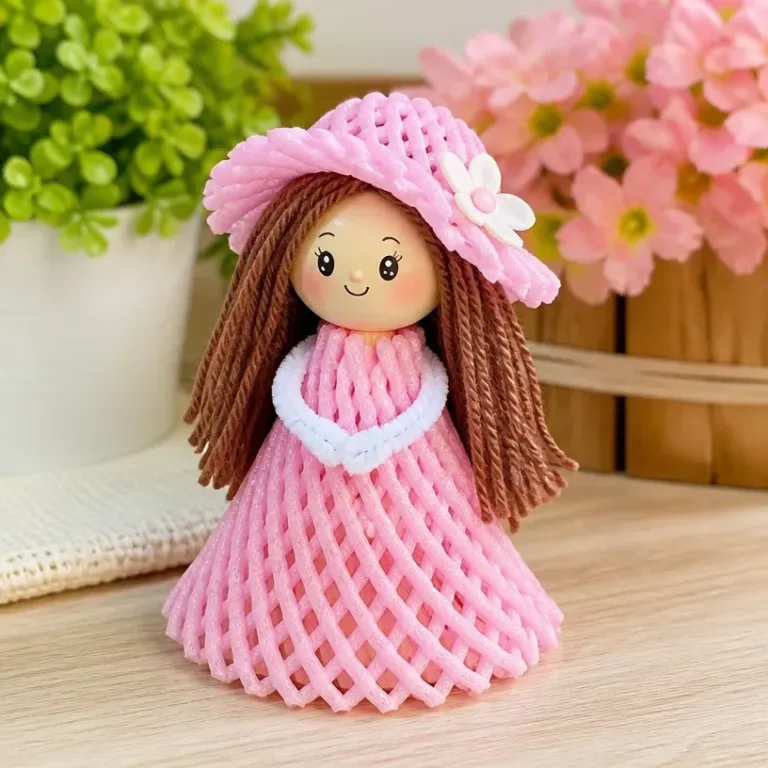 Cute mini doll crafted from a fruit foam net