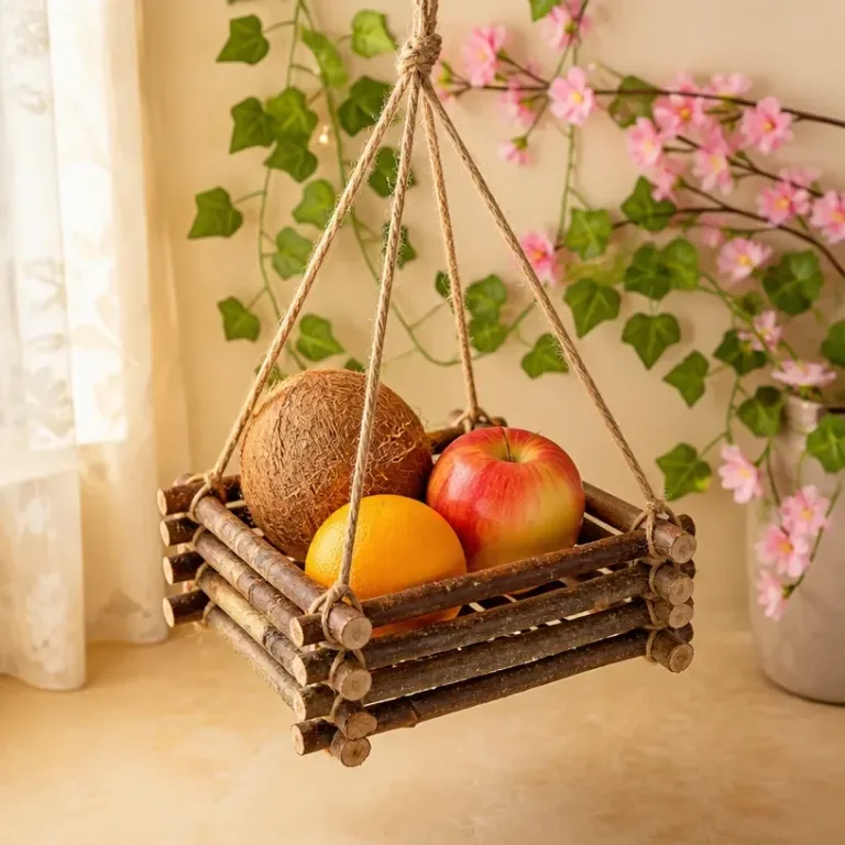 Homemade fruit basket made from tree branches and colorful fruits.