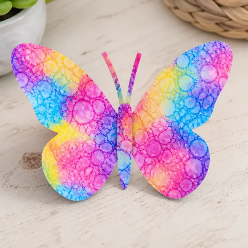 Colorful bubble print art featuring transformed butterfly wings